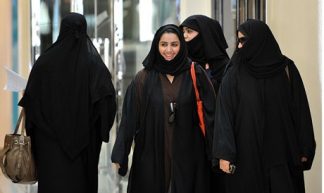 Saudi women walk inside the Faysalia shopping centre in Riyadh - Tribes of the World