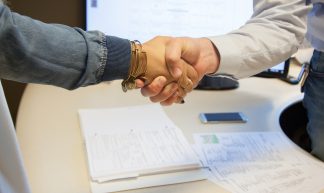 handshake sealing the deal - franchise opportunities