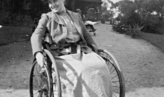Edwardian polio girl in wheelchair - jackcast2015