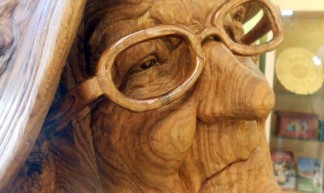 Wood sculpture--old woman at the Vesterheim visitor's center - rochelle hartman