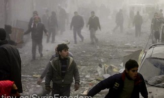 People in Douma rush away from the site of the airstrike