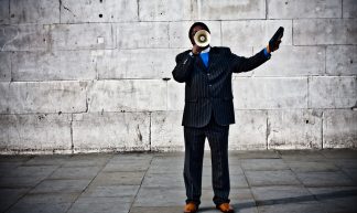 With A Megaphone By A Wall - Garry Knight