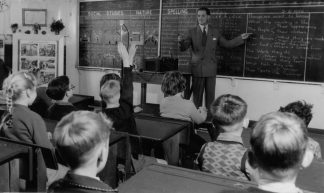 Teacher, Grade 3, preparing for film showing, 1954 - Public Record Office Victoria