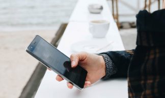 Young woman using smartphone. Outdoors - Marco Verch Professional Photographer and Speaker